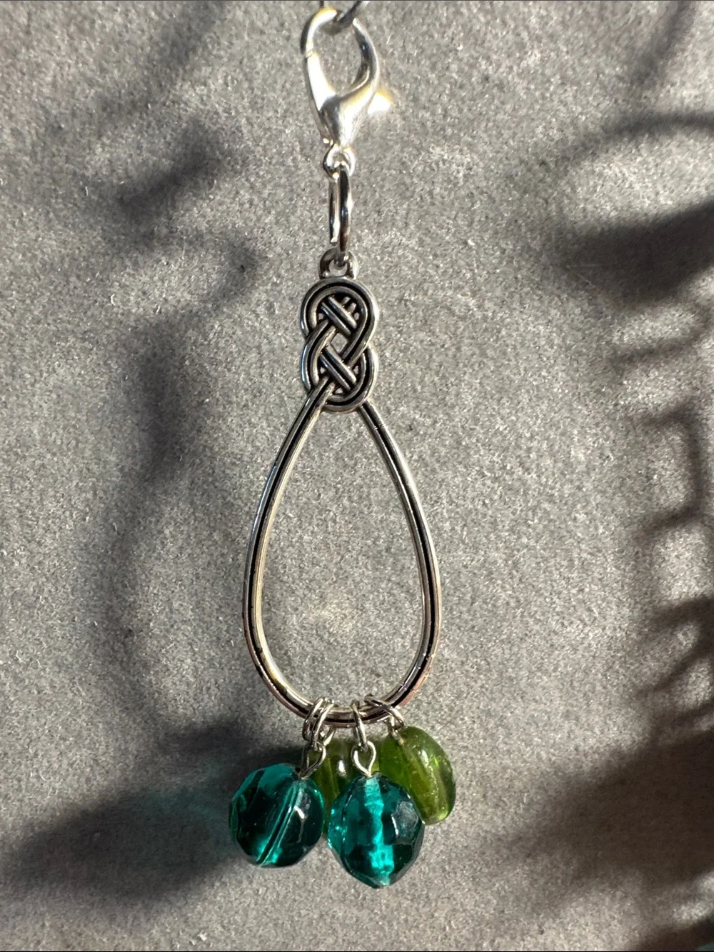 Hand Crafted Silver Sunburst Keychain with Turquoise and Red Accents